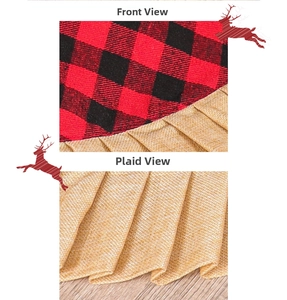 Detail of red buffalo plaid Christmas tree skirt with ruffled edge on wood floor