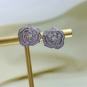 Elegant silver camellia flower earrings with sparkling cubic zirconia pavé setting