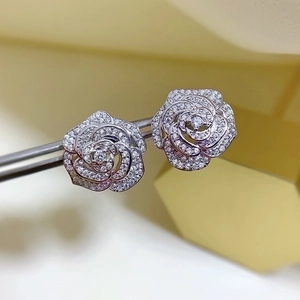 Elegant silver camellia stud earrings featuring pave-set cubic zirconia flower petals