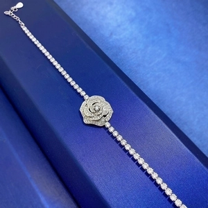 S925 sterling silver rose bracelet with sparkling cubic zirconia on a blue jewelry box