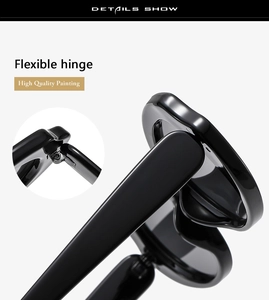 Macro detail of high-quality flexible hinge on glossy black oval sunglasses frame