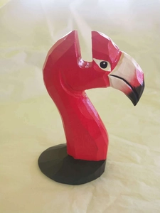 Macro shot of geometric wooden flamingo glasses holder with red and black finish