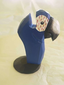 Detailed blue parrot wooden glasses holder featuring hand-carved textures and round base