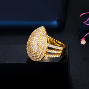 Golden pear shaped ring with micro paved clear zircons and triple row band design