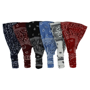 Detailed view of six elastic paisley headbands in various colors with boho patterns