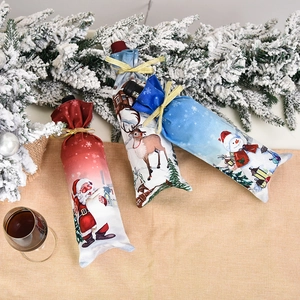 Christmas wine bottle covers with Santa Reindeer Snowman motifs and golden ribbons
