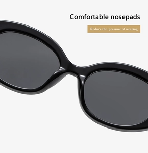 Detail of integrated nose pads on black retro oval sunglasses for comfort