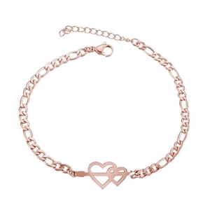 Detail of rose gold Figaro chain bracelet featuring a double heart with arrow design