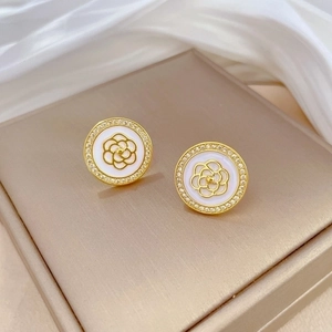 Elegant gold camellia stud earrings with white micro-pave crystals and enamel finish