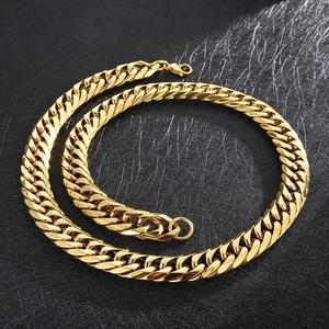 Classic flat Cuban link chain necklace in gold-finished stainless steel on black background