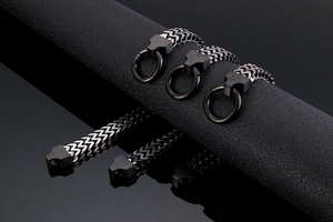 Macro detail of gunmetal stainless steel keel chain with sturdy round carabiner clasp