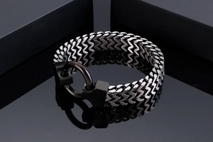 Macro detail of industrial silver and black titanium steel chain with a large ring clasp