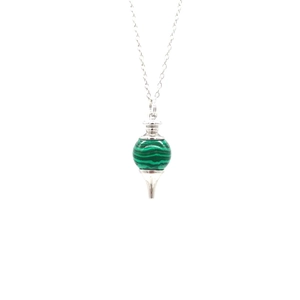 Detail view of retro silver necklace featuring a green malachite gemstone sphere