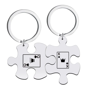 Matching stainless steel puzzle keychains with King and Queen of Hearts playing cards