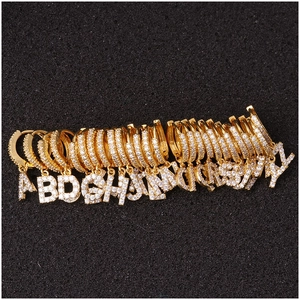 Gold letter earrings with crystal zircon pendants in a complete A-Z alphabet collection