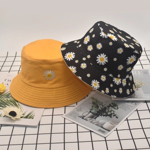 Breathable cotton reversible bucket hats in yellow and black daisy floral print styles