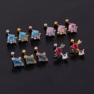 Various stainless steel stud earrings with colorful zircon stones on black background