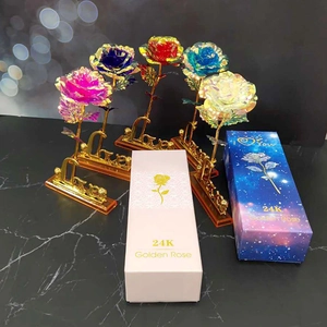 Detail showing artificial gold foil roses in various colors with Love stand and gift box