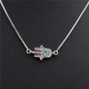 Silver Hamsa Hand necklace with blue gemstone and micro-pave zircons on box chain