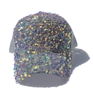 Close-up of rainbow sequins on baseball cap with breathable grey mesh back