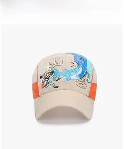 Detail of kids mesh baseball cap with cartoon shark embroidery and breathable side panels