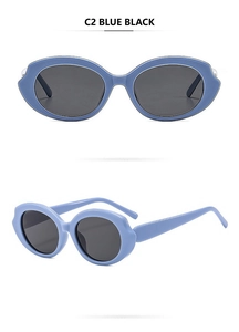 Detail of blue oval sunglasses showing wave-edge frame design and dark resin lenses