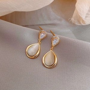 Elegant gold drop earrings with white opal stone and sparkling cubic zirconia crystal