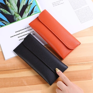 Slim long leather wallet for women with litchi texture in black and orange colors