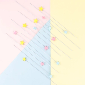 Colorful EVA foam star cake toppers in pink, yellow and blue for party decorations