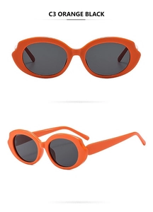 Detail view of bold orange wave frame sunglasses with black lenses and sleek temples