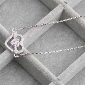 Silver copper necklace featuring a double heart pendant with colorful zircon stones