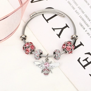Silver woven bracelet with pink rhinestone beads and delicate honey bee charm