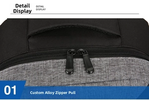 Detail view of custom alloy double zipper on black and grey Oxford fabric backpack