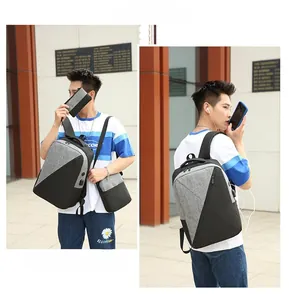 Detail view of Oxford fabric backpack featuring a built-in USB charging port and waterproof material