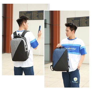 Detail view of Oxford cloth business backpack with built-in USB charging port and dual tone design