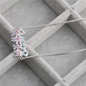 Micro-pave zircon family pendant necklace with blue and pink gems on a silver chain