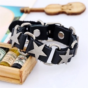 Punk style genuine black leather bracelet with three silver star metal charms and studs