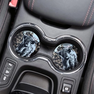 Car cup holders with two highland cow print coasters featuring leopard patterns