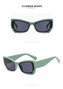 Detailansicht der zweifarbigen Cat-Eye-Sonnenbrille in Grün und Schwarz mit grauen Gläsern