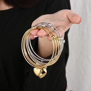 Fashionable double-layer stainless steel bangle with heart pendant in gold and silver
