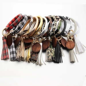 Detailed collection of assorted PU leather keychain bangles with wood tags and tassels