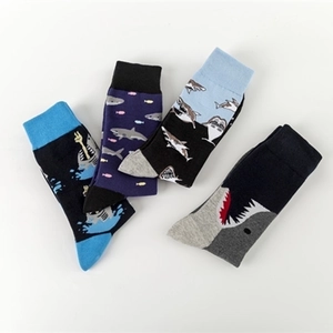 Set of four cotton crew socks with colorful shark patterns in navy, black, and grey