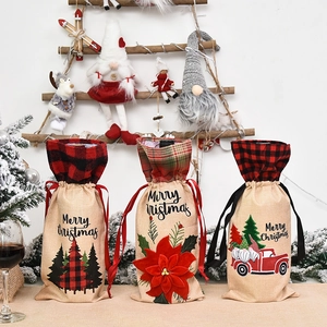 Three-piece burlap Christmas wine bottle bags with Santa, tree, and truck patterns