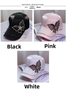 Detailed view of satin baseball caps in black, pink, and white with rhinestone butterflies