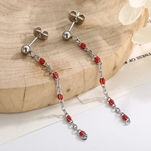 Long silver chain tassel earrings featuring elegant red transparent beads and studs