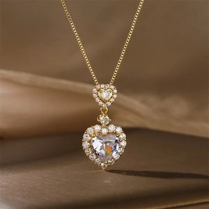 Macro detail of luxury double heart pendant necklace with shimmering crystals on silk