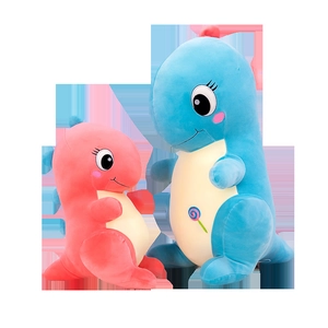 Cute pink and blue soft plush dinosaur pillows with lollipop embroidery on white background
