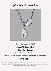 Detail view of vintage silver rectangle charm necklace with Good Luck engraving and chain specs