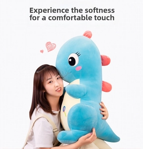 Soft blue dinosaur plush pillow with lollipop embroidery and smooth velvet texture