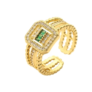 Vintage gold-plated ring with green rectangle zircons and wide multi-layer open band